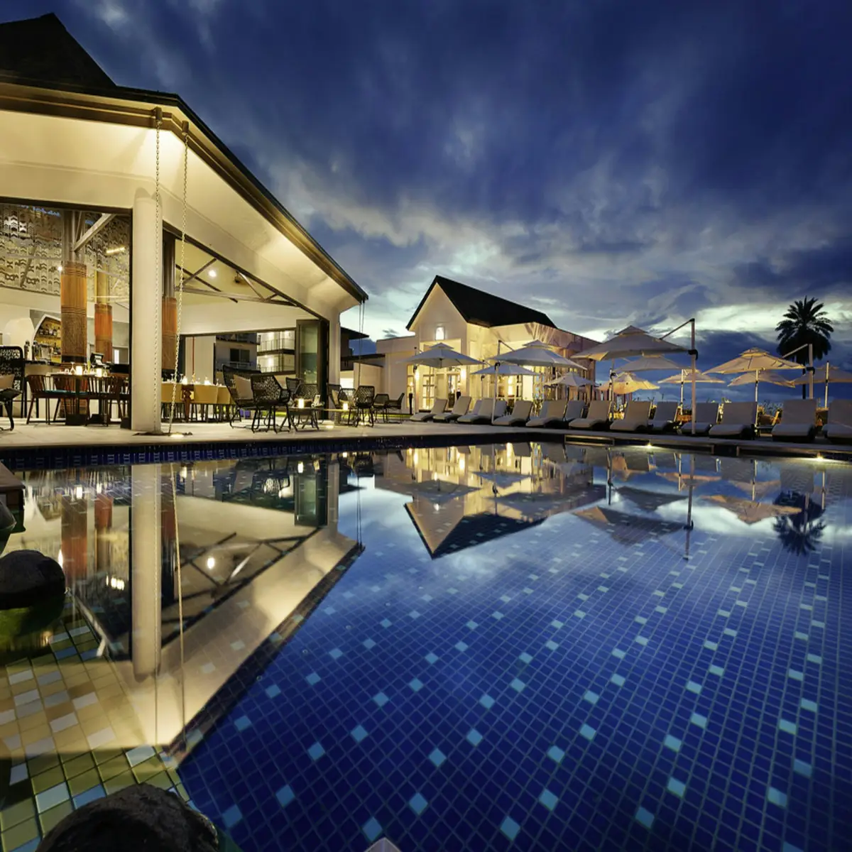 Luxury resort pool at dusk